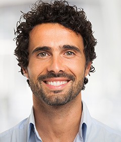 Close up of bearded man standing and smiling