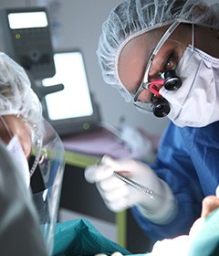 oral surgeon performing implant placement