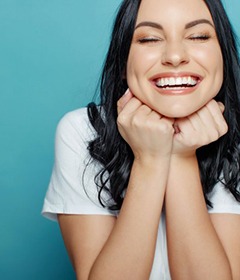 Young woman smiling and enjoying her straight teeth